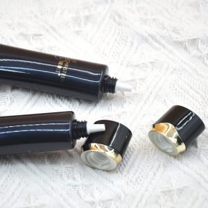 black cream tube with oval cap