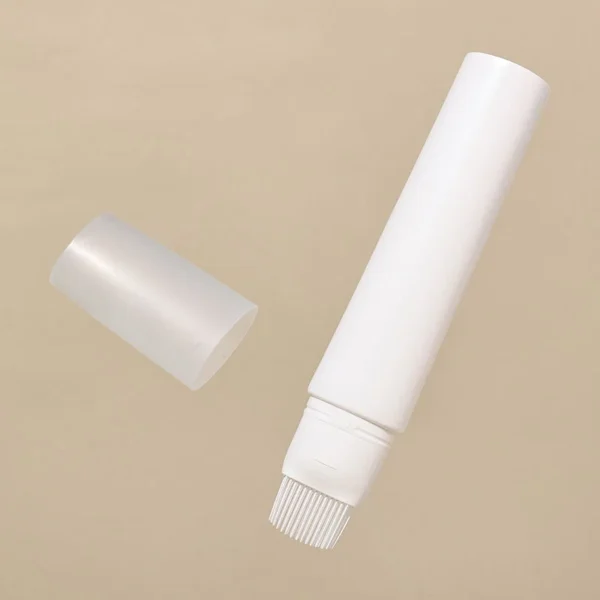 squeeze cosmetic tube with brush applicator