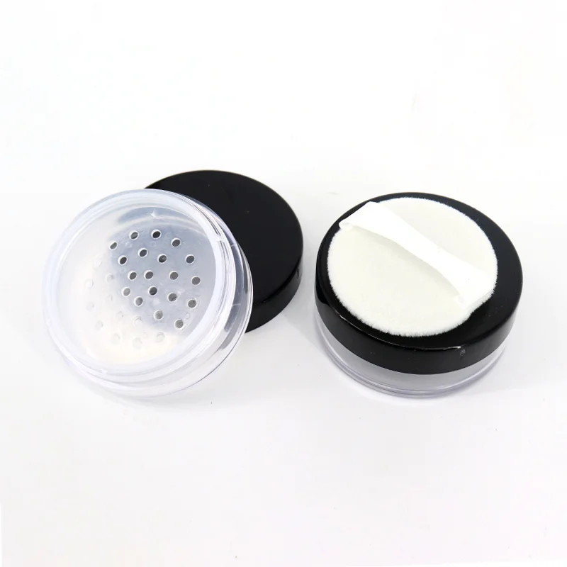 empty loose powder jar with puff