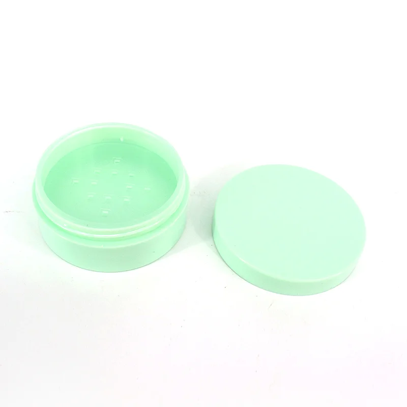 green plastic loose powder jar
