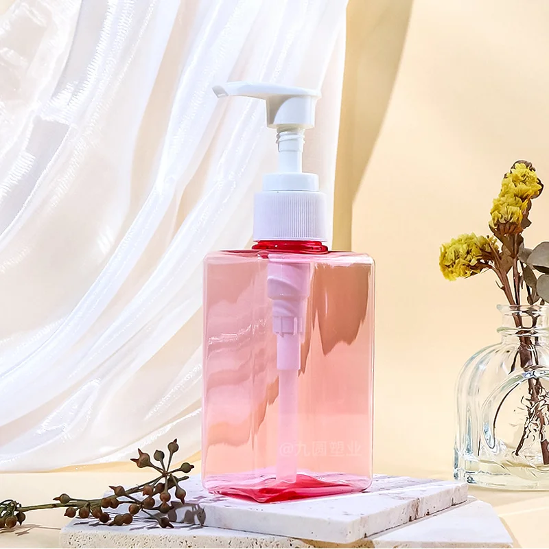 transparent pink shampoo pump bottle