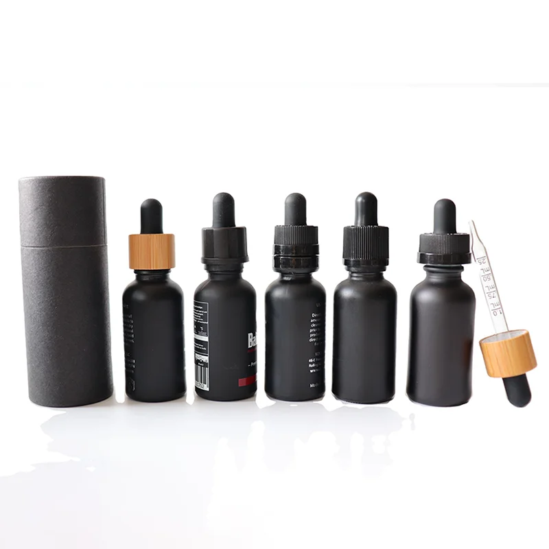 black glass essential oil bottle with storage box
