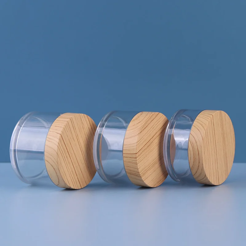 clear plastic cosmetic jar with wood grain lid
