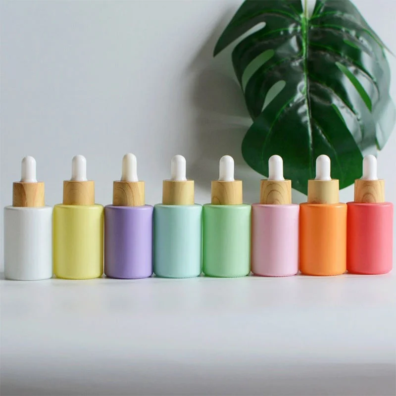 colorful essential oil bottles with bamboo dropper lids