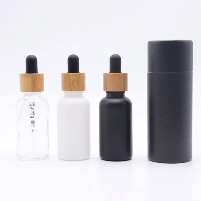 black glass dropper bottle with bamboo lid