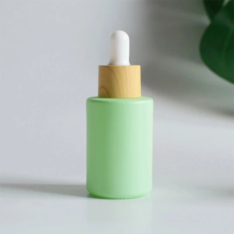 green essential oil packaging bottle
