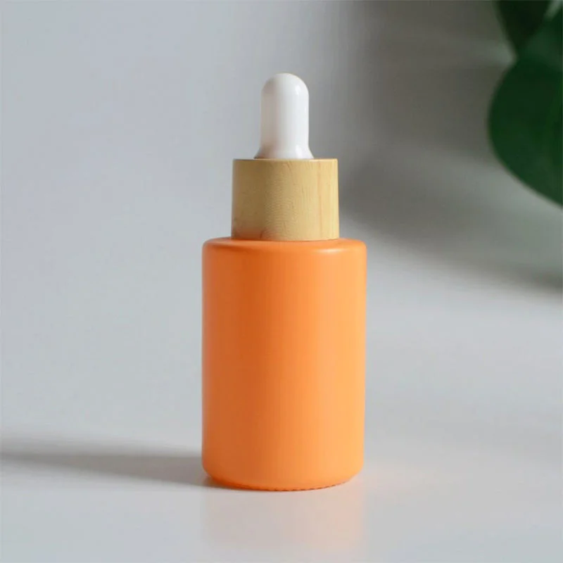 orange essential oil bottle with bamboo dropper