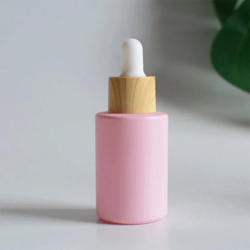 pink glass essential oil dropper bottle