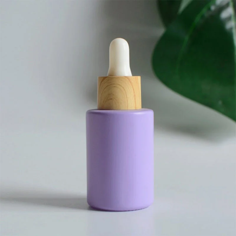 purple glass dropper bottle for essential oil packaging