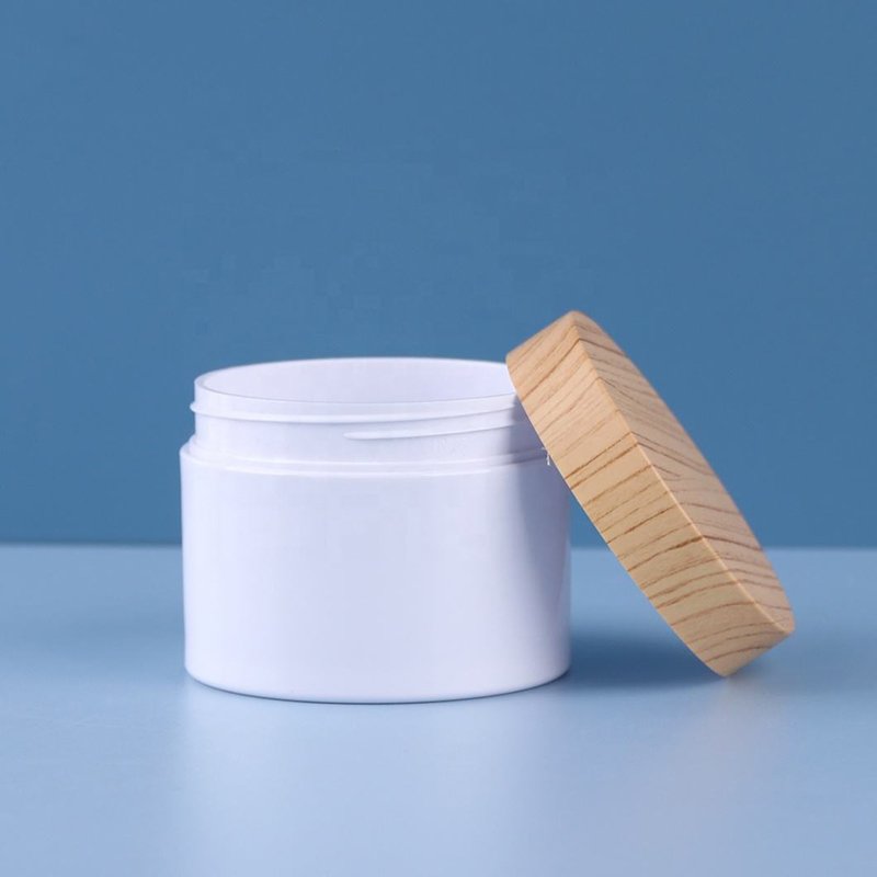 white PET plastic cream jar with woodgrain plastic lid