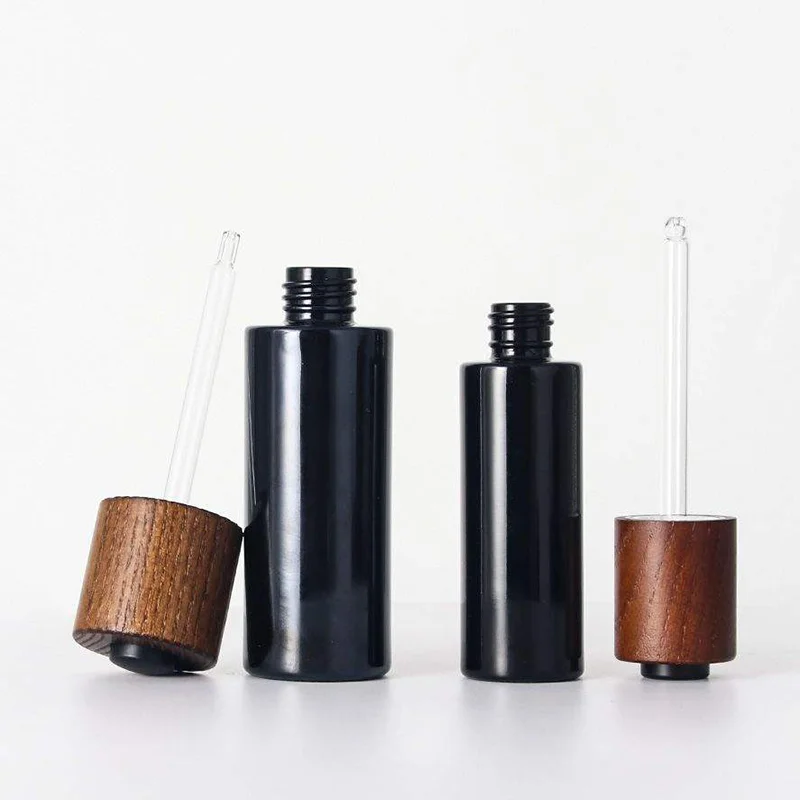 black glass dropper bottle with push button lid