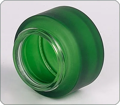dark green glass cosmetic container