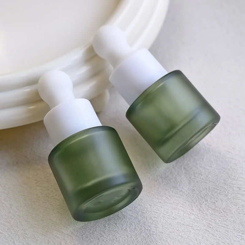 green frosted glass eye dropper container