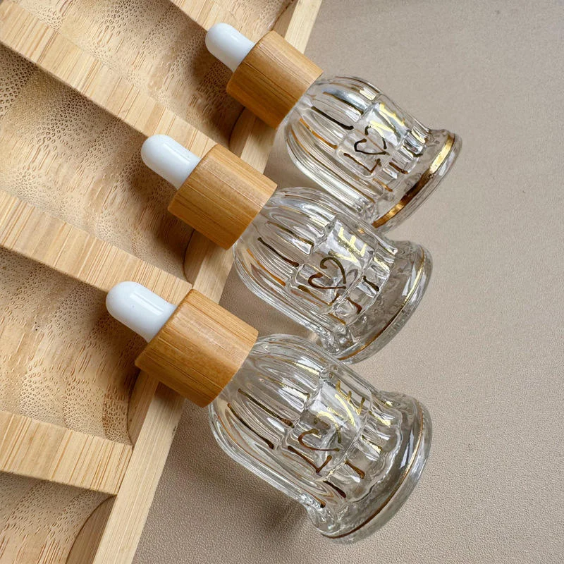 glass and bamboo tincture bottles with dropper