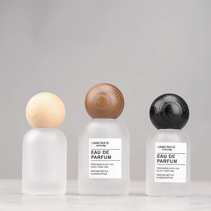 glass pray bottles with wood lids
