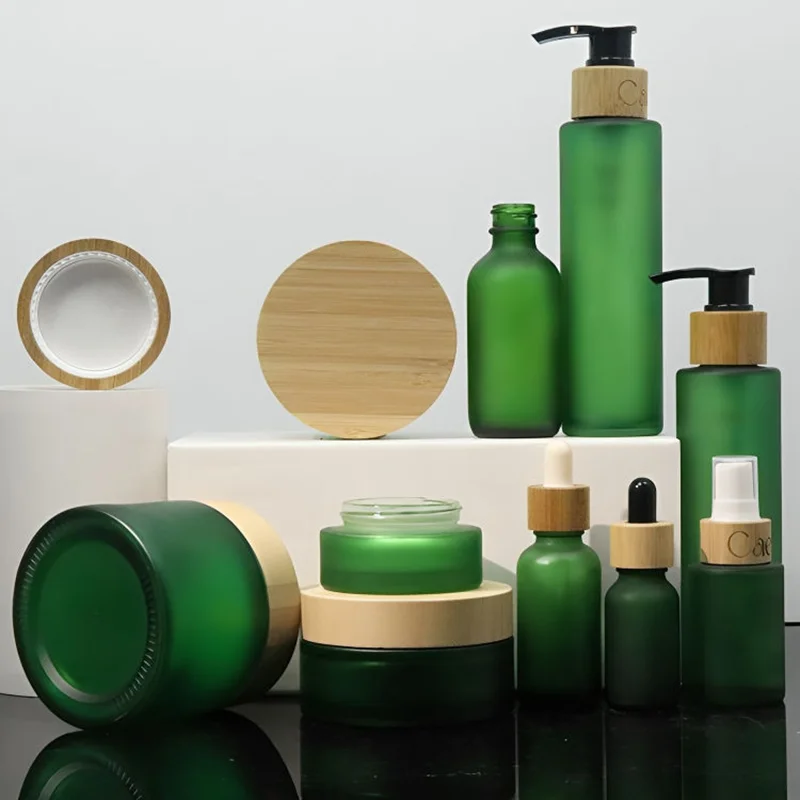 green glass cosmetic containers with bamboo lids