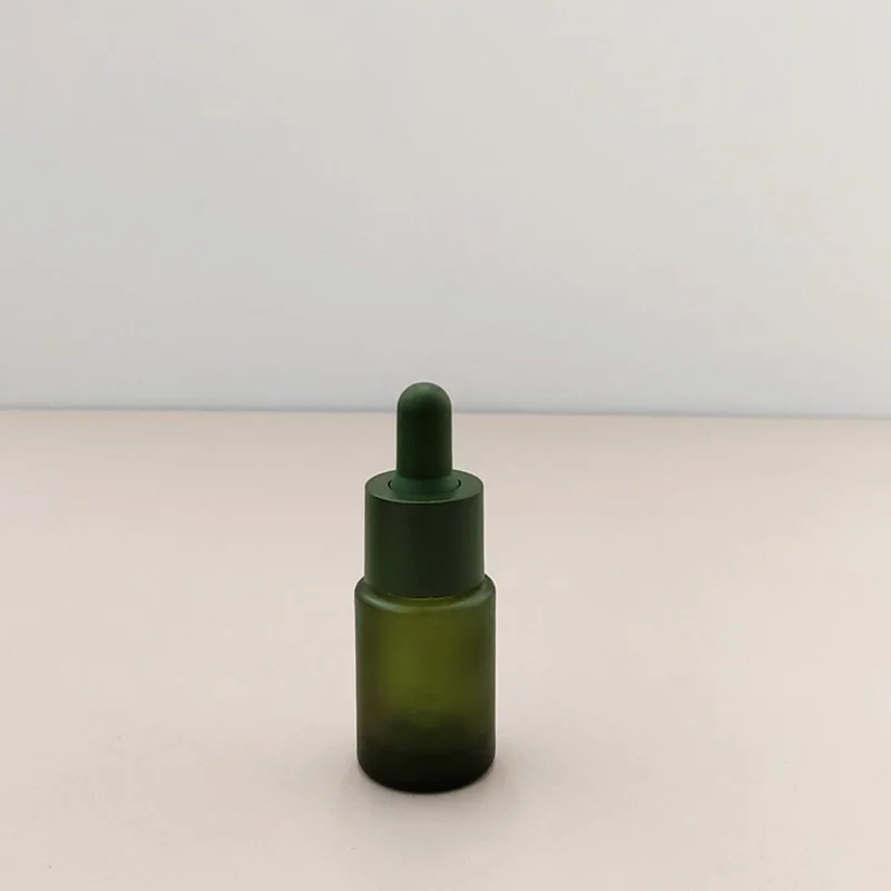 olive green matte glass serum bottle