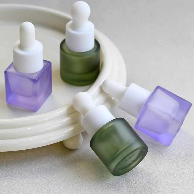 purple green glass dropper bottles
