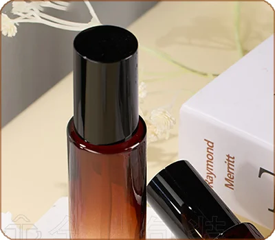 amber lotion bottle with black outer cap