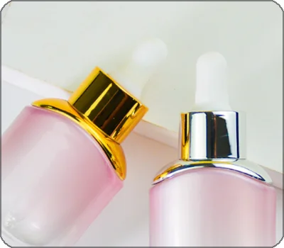 round silver gold shoulder dropper bottle