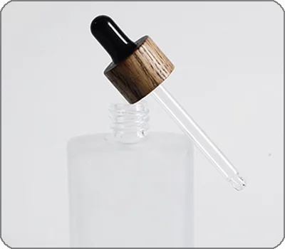 glass dropper with wood collar
