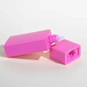 empty square sunblock pink bottle